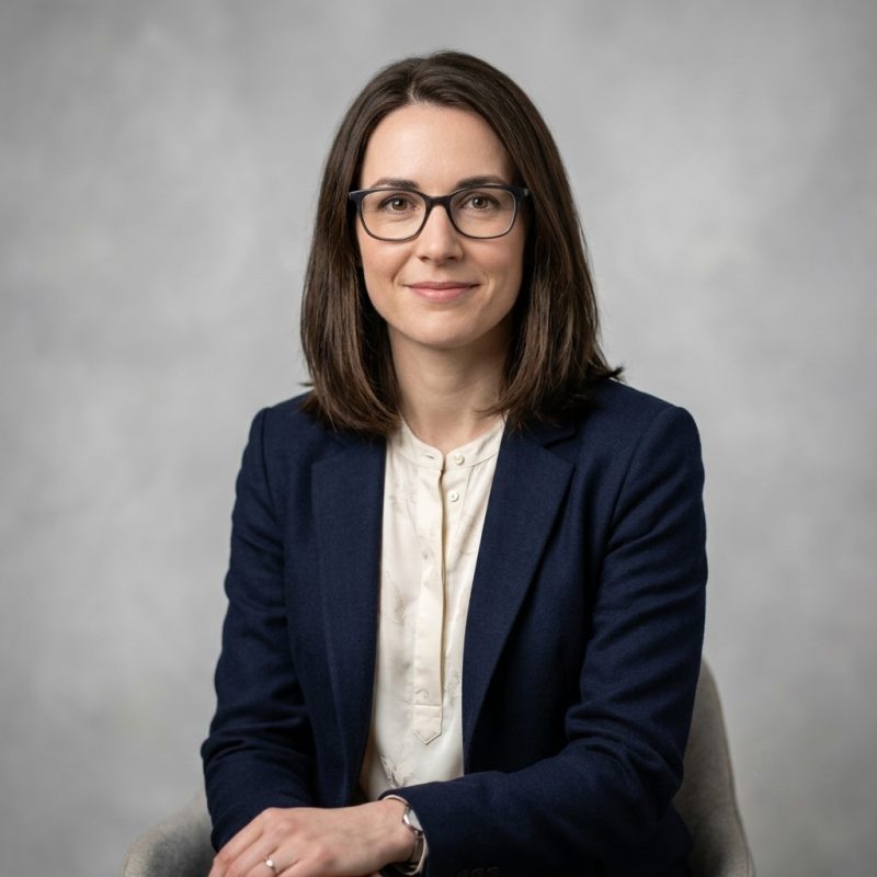 Woman in glasses and suit